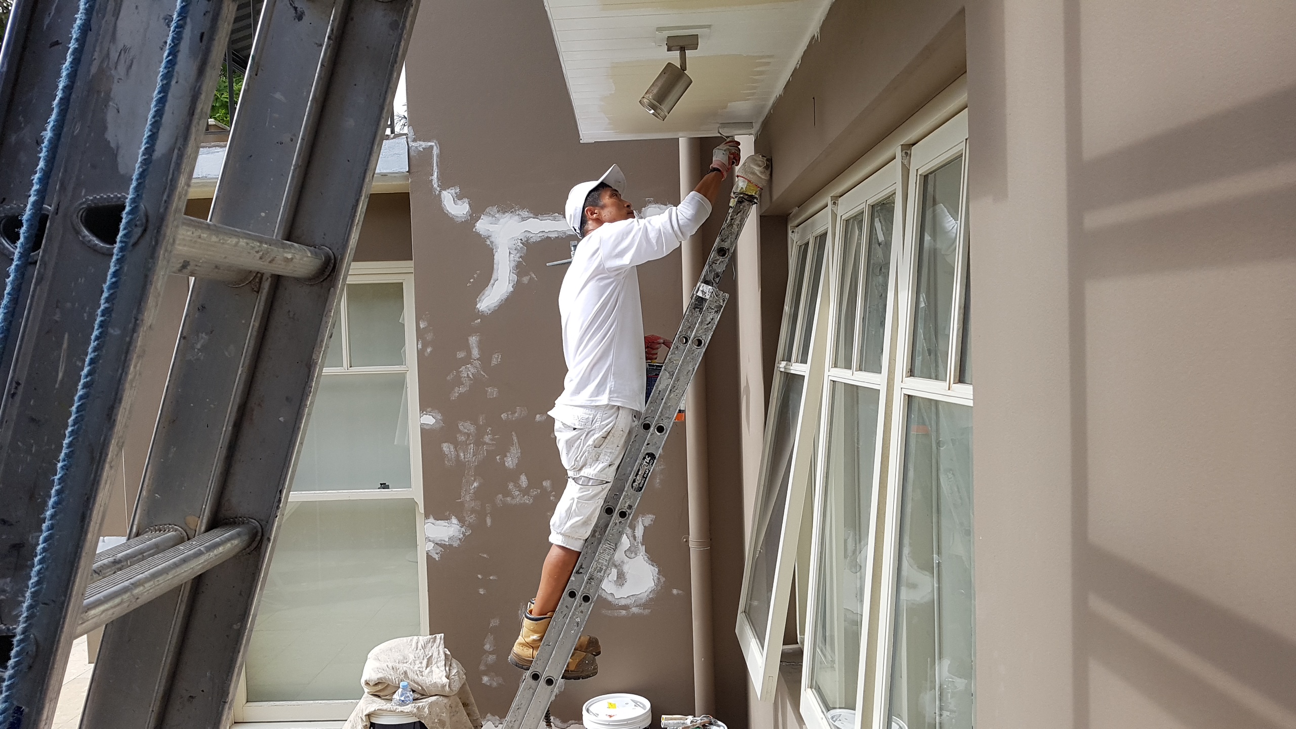 Chris painting on the job